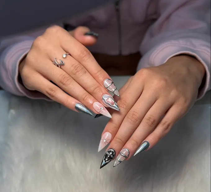 Chrome silver and black stiletto set with crystal star art, by Nails First Garston