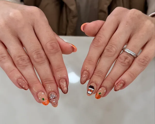 Short natural nails with tiny autumn leaf and pumpkin art