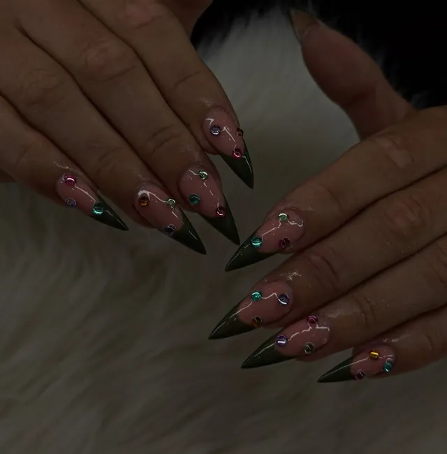 Deep green BIAB stiletto set with rainbow gem details