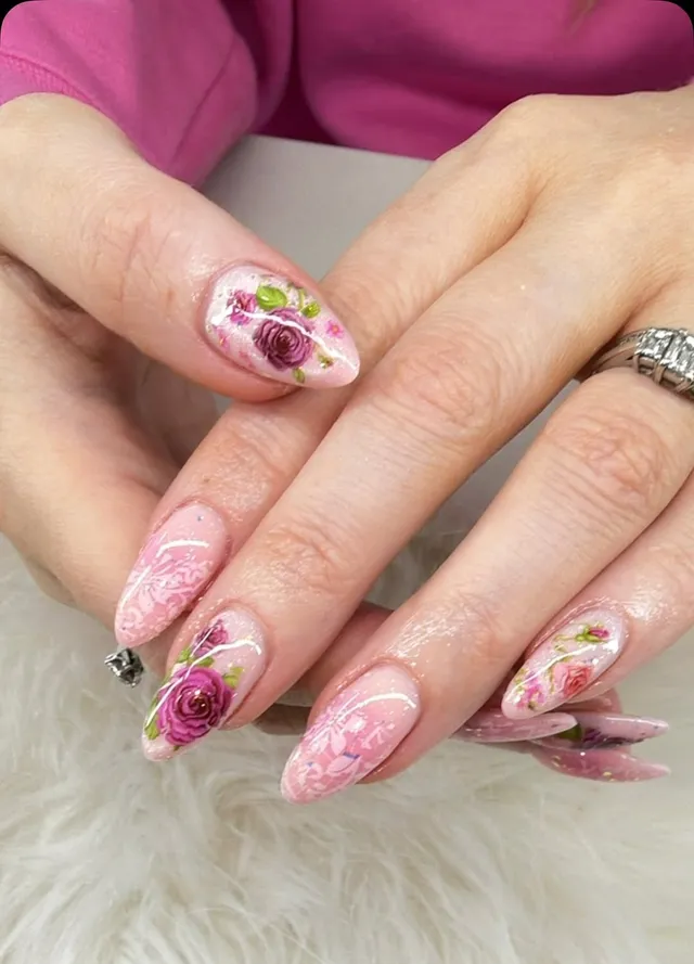 Vintage rose nail art with glitter on almond nails